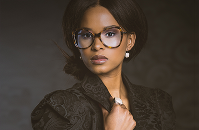 A beautiful black woman wearing glasses